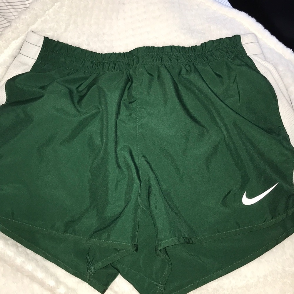 Green running Nike shorts